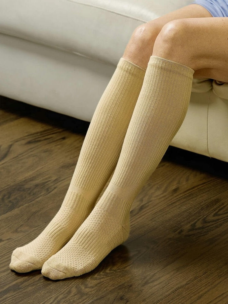 Tan Compression socks worn while seated