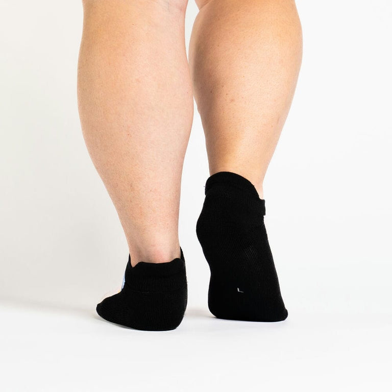 A person walking in ankle socks